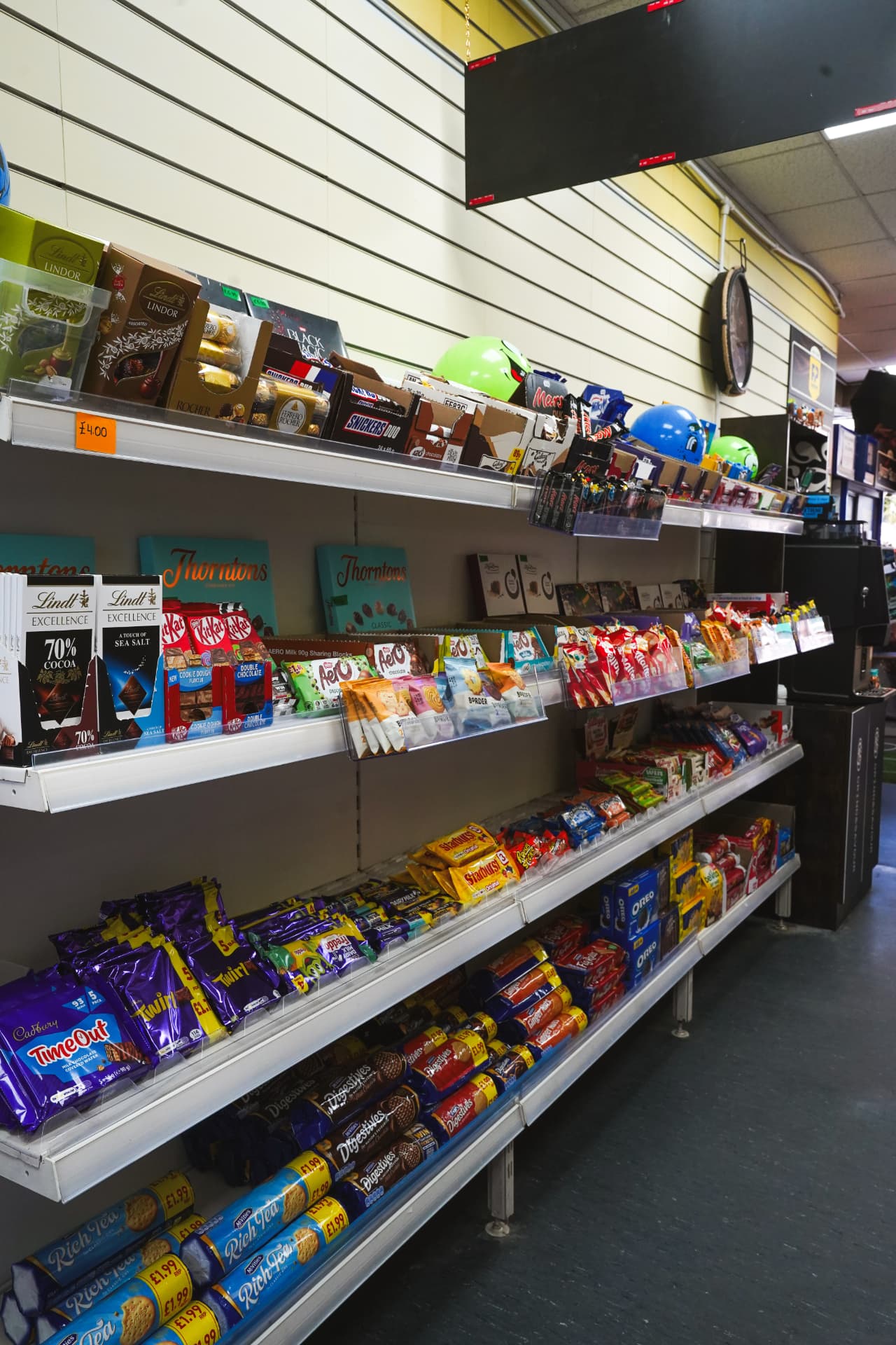 Shelves of chocolate and sweets in store